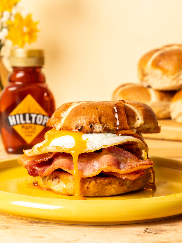 Hot cross bun bacon sandwich with maple syrup