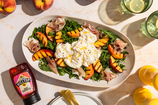Peach & Proscuitto salad with chipotle hot honey drizzle