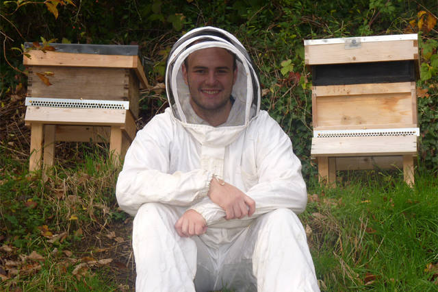 Scott with beehives